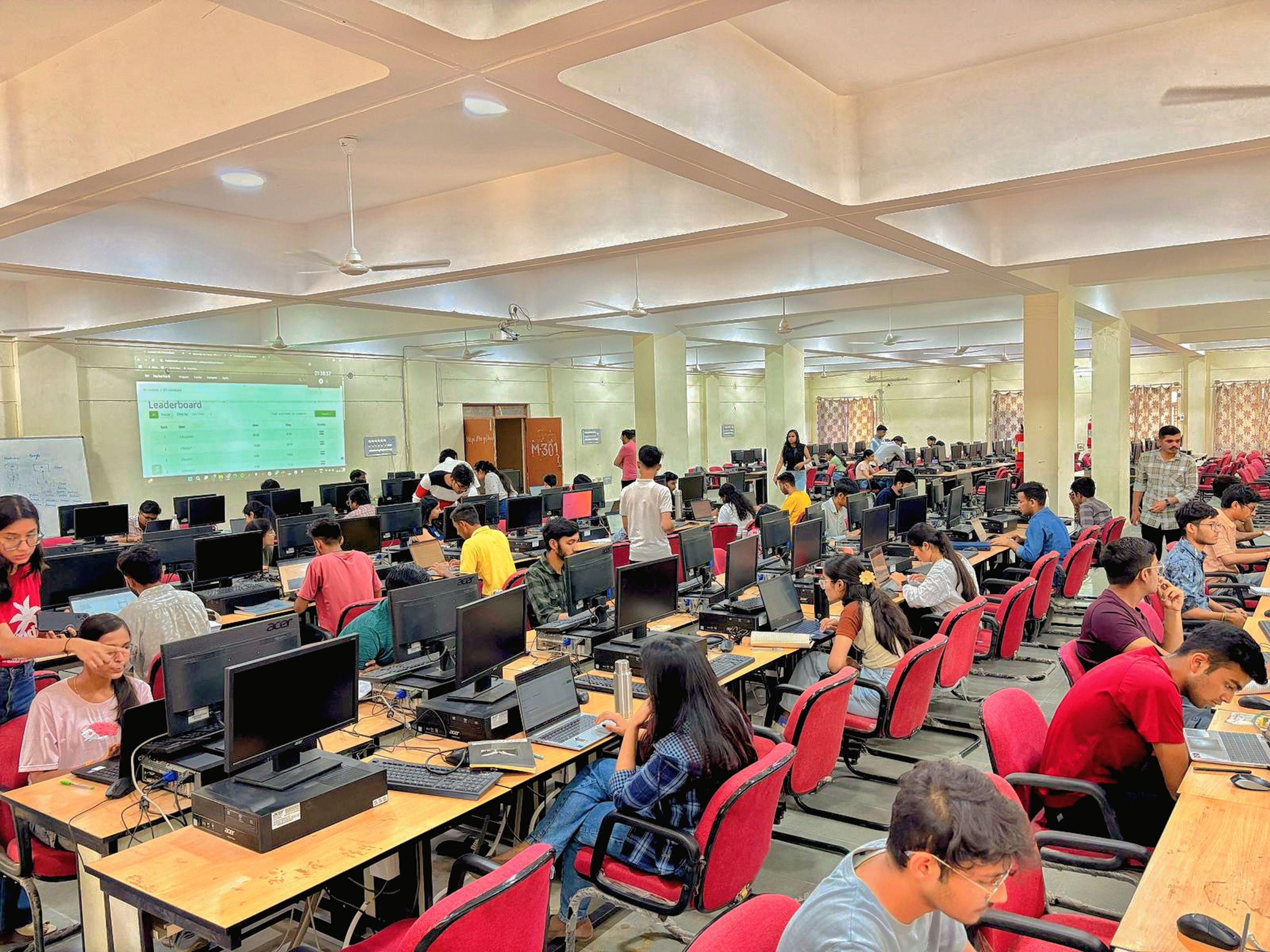 Students working in computer lab with desktop computers